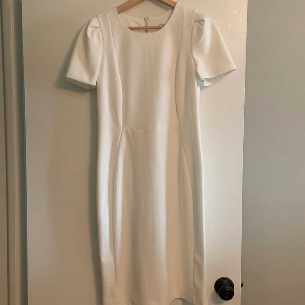 White straight dress, perfect for brides.